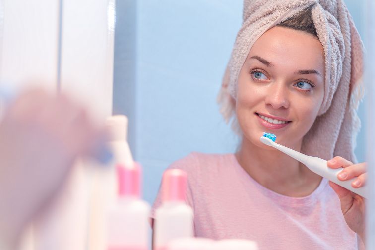 how to use an electric toothbrush