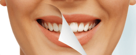 A woman's mouth with a piece of paper on it.