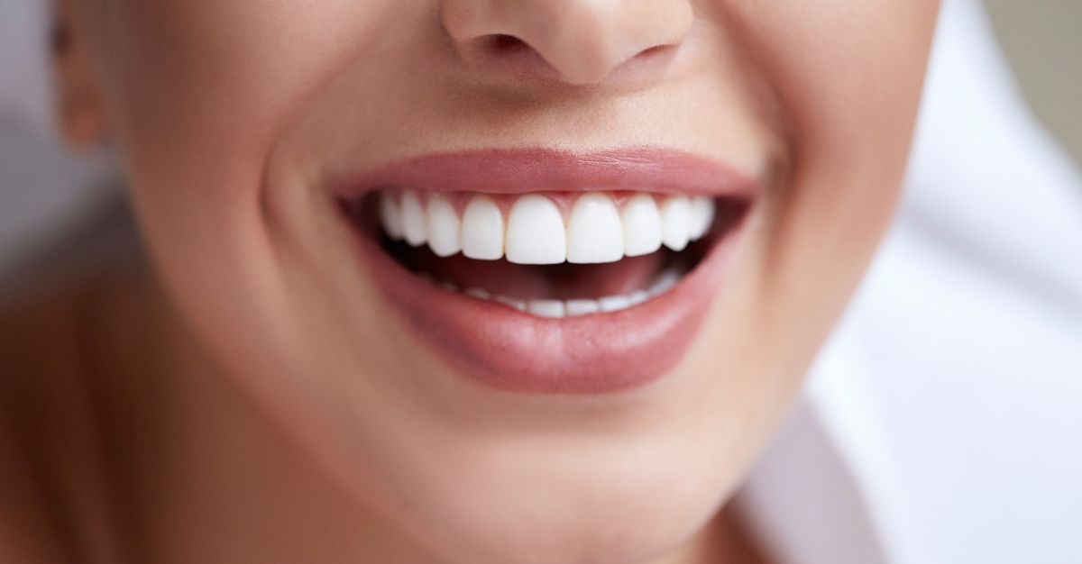 A close up of a woman's teeth.